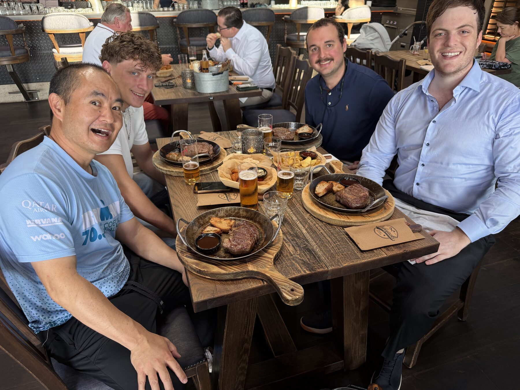 Leo Pohlmann with Dennis Yu and Justin Sonnenreich over ribeye steaks at Timberjacks