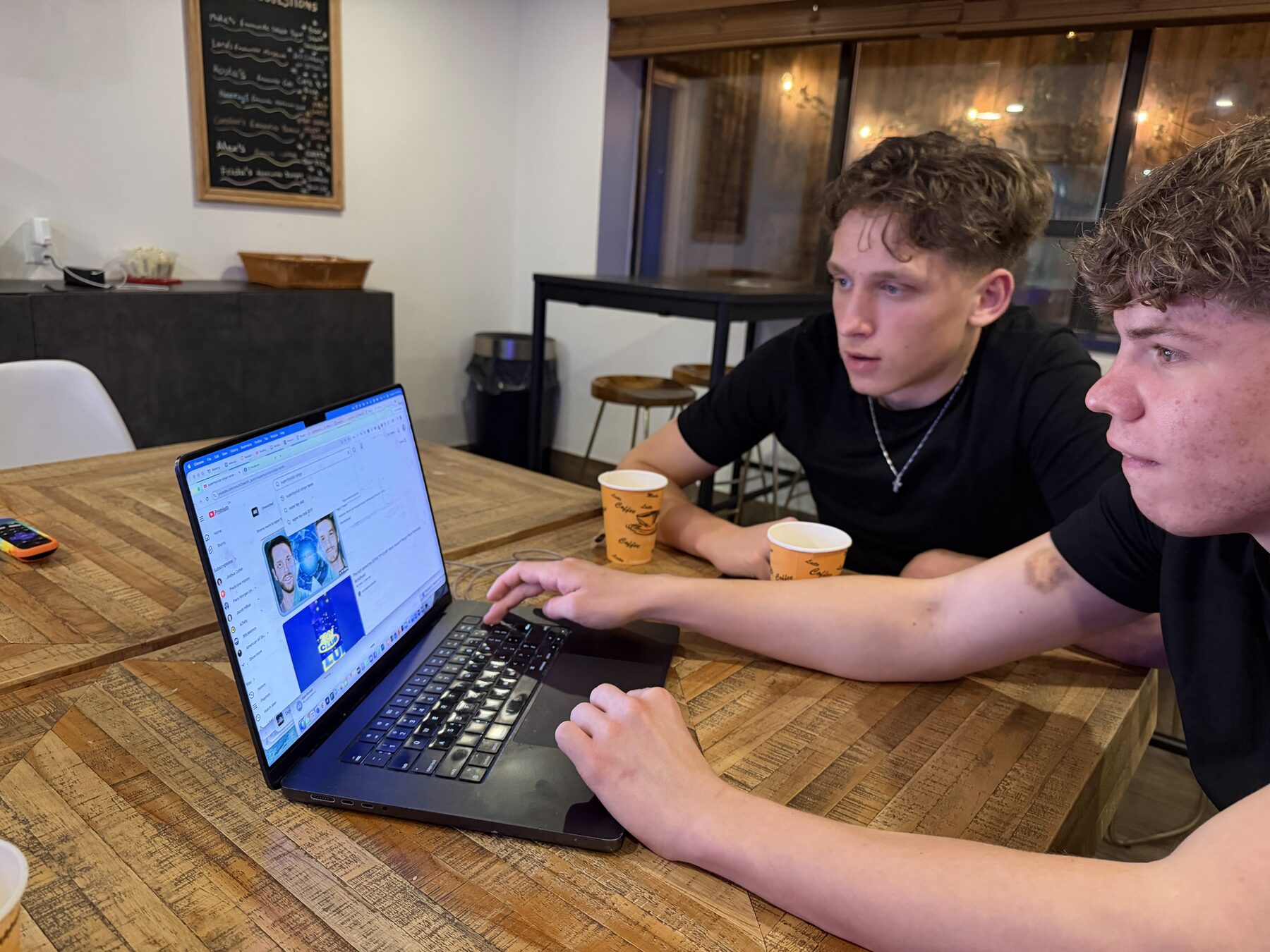 Leo Pohlmann and Leonard Rast working on a laptop in Toronto